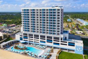 an aerial view of a hotel with a pool at SpringHill Suites by Marriott Panama City Beach Beachfront in Panama City Beach