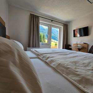 Postel nebo postele na pokoji v ubytování Bergkristall B&B