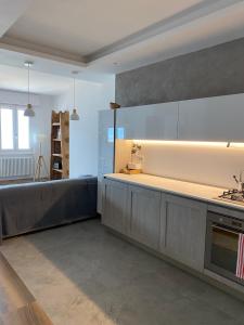 a kitchen with a sink and a counter top at ORO, 8 in Bellano
