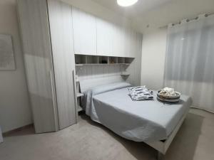 Ліжко або ліжка в номері La Casa di Tommy