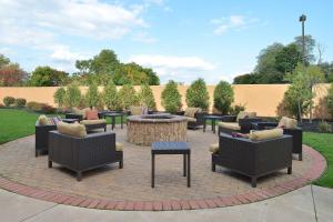 a patio with chairs and a table and a fire pit at Courtyard Mt. Holly Westampton in Westampton Township