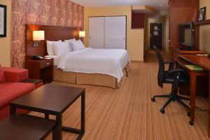 a hotel room with a bed and a desk at Courtyard Mt. Holly Westampton in Westampton Township