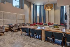 a lobby with a large wooden table and chairs at Residence Inn by Marriott Nashville Green Hills in Nashville