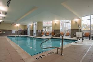 a large swimming pool in a hotel room at Courtyard by Marriott Raleigh-Durham Airport/Brier Creek in Raleigh