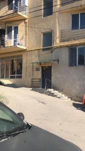 a car parked in front of a building at Welhome to a city centre Cozy and Comfy For leisure and Work No go through No other guests Just one host who you can ghost in Tbilisi City