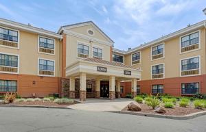 a large apartment building with a courtyard at Extended Stay America Suites - Pleasant Hill - Buskirk Ave in Pleasant Hill
