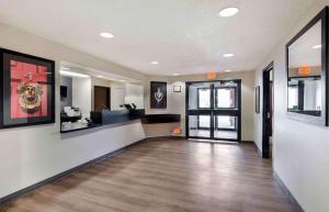 a hallway with a lobby with a reception desk at Extended Stay America Suites - Kansas City - South in Kansas City