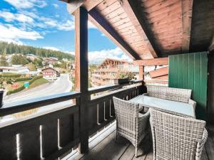 a balcony with chairs and a view of a mountain at AlpenLuxus' LUNA with relaxation room, sauna & car park in Seefeld in Tirol