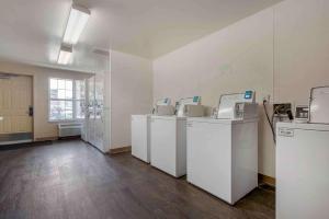 an empty room with four washing machines in it at Extended Stay America Suites - Santa Rosa - South in Santa Rosa