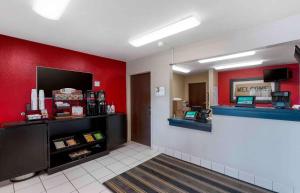 a fast food restaurant with a red wall at Extended Stay America Suites - Sacramento - White Rock Rd in Rancho Cordova