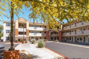 an apartment building with a street in front of it at Extended Stay America Suites - Phoenix - Scottsdale - North in Scottsdale