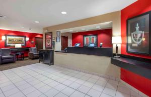 a waiting area of a hospital with red walls at Extended Stay America Suites - Chicago - Schaumburg - I-90 in Schaumburg