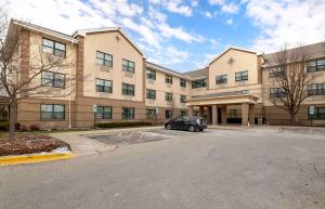 a building with a car parked in front of it at Extended Stay America Suites - Chicago - Schaumburg - I-90 in Schaumburg