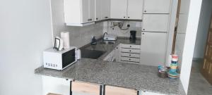 Kuchyň nebo kuchyňský kout v ubytování Apartamento de verano en Vilagarcía de Arousa