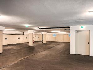 an empty parking lot in an empty parking garage at RUHESTUBE - AlpenLuxus Collection in Fügen