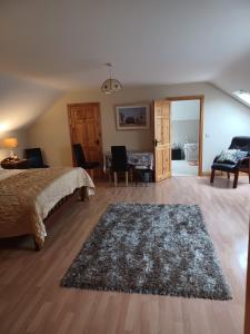 a bedroom with a bed and a living room at Country Haven eircode H54 AK31 in Galway