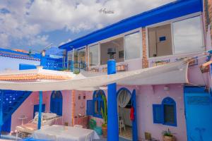 a toy house with blue and pink at DAR DAUIA in Chefchaouen