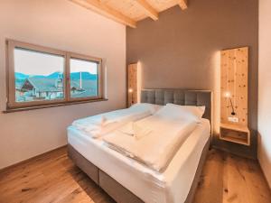 Ένα ή περισσότερα κρεβάτια σε δωμάτιο στο VIVAZILARE Loft - AlpenLuxus Collection