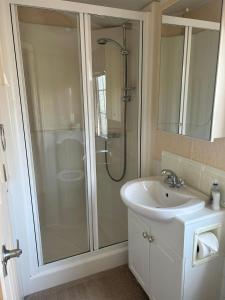 a bathroom with a shower and a sink at Stunning Holiday Home Whithorn3 in Newton Stewart