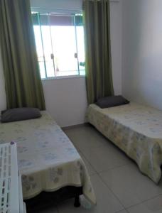 Krevet ili kreveti u jedinici u okviru objekta Casa Condomínio Arraial do Cabo