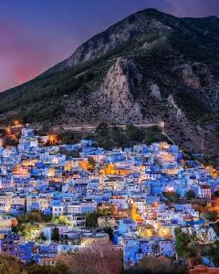 a view of the blue city of chefchaouen at night at Joli studio de charme à chaouen in Chefchaouene