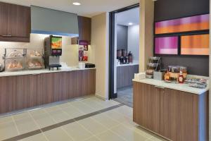 a fast food restaurant with a cash register and a cafeteria at Residence Inn by Marriott Cedar Rapids South in Cedar Rapids