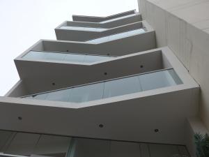 a staircase in a building with glass risers at Spacious Apartment in Miraflores in Lima