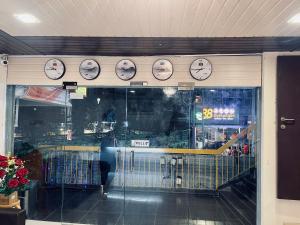 a store window with clocks on the wall at Hotel City Bukit Bintang in Kuala Lumpur