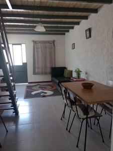 a living room with a table and a couch at La Baquiana 2 in Mercedes