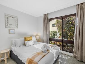 Ένα ή περισσότερα κρεβάτια σε δωμάτιο στο Maroochy Beachside 3 Bedroom Getaway