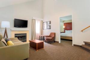 a living room with a couch and a fireplace at Residence Inn Chicago Deerfield in Deerfield