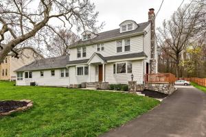 a white house with a porch and a driveway at 5 Bdrm House (Sleeps 10) Horsham-Philadelphia in Horsham