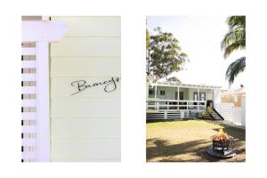 a white garage with the word honey written on it at Barney's Beach House Narrawallee in Narrawallee