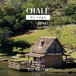 a shack on the water with a sign that reads chile do lago at Eco Mirante Hotel in Paulo Lopes