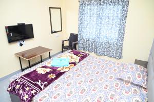 Postel nebo postele na pokoji v ubytování Hotel Nakshatra Resort