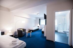 Una cama o camas en una habitación de Arcade Hotel & Hostel Hamburg