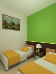 Кровать или кровати в номере The Cabin Hotel Mantrijeron