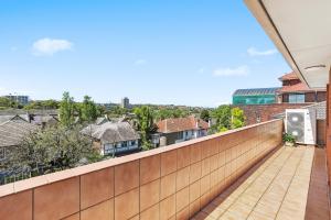 a balcony with a view of the city at Randwick l 3 Bedroom Apartment + Parking in Sydney