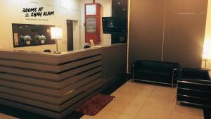 a lobby with a reception desk in a building at Rooms at Hotel Shah Alam in Shah Alam