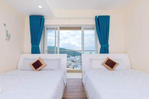 Postel nebo postele na pokoji v ubytování VUNG TAU GOLDSEA near Back Beach + 39 fotografií