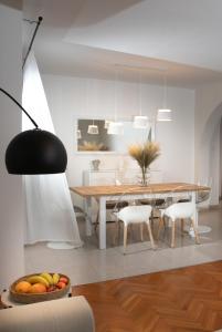a kitchen and dining room with a table and chairs at Apartment "Istra Inspirita II" in Rovinj