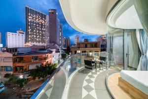 a balcony with a view of a city skyline at GoldCoast Hotel Nha Trang in Nha Trang