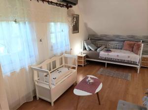 Posteľ alebo postele v izbe v ubytovaní Vendégház a Csabay Kúriához