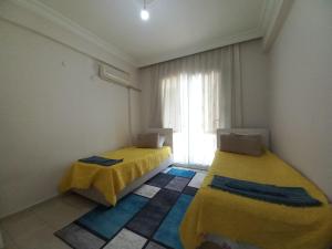 Postel nebo postele na pokoji v ubytování Perfect Holiday Condo at Central Fethiye Best for Families