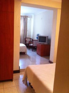 TV a/nebo společenská místnost v ubytování Ivys Hotel + 16 fotografií