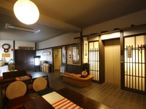 a living room with a couch and a table at Kisoji no Yado Iwaya in Kiso +45 photos