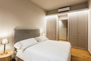 Posteľ alebo postele v izbe v ubytovaní Ferrini Home - Piazza Trento