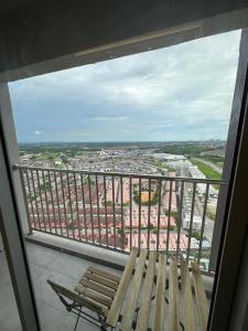 a balcony with a bench and a view of a city at Ulike Homestay-3Room-4 king Size Bed-The Venus in Sitiawan