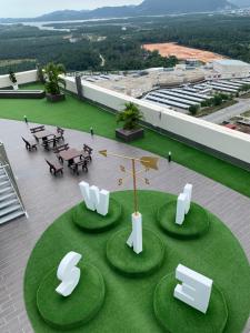 an overhead view of a building with tables and chairs at Ulike Homestay-3Room-4 king Size Bed-The Venus in Sitiawan