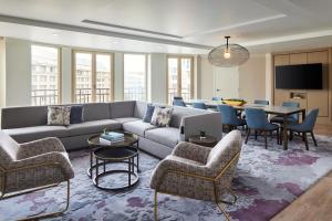 a living room with a couch and chairs and a table at Westin Georgetown, Washington D.C. in Washington